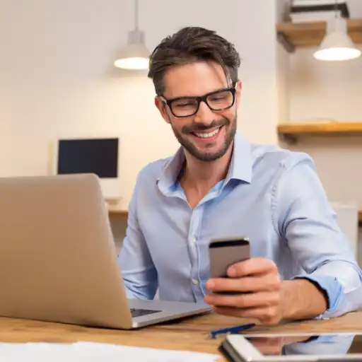 How long does it take to Remortgage? 1 A happy client on the phone at home, smiling with relief after speaking to hislocal mortgage advisor in West Sussex.
